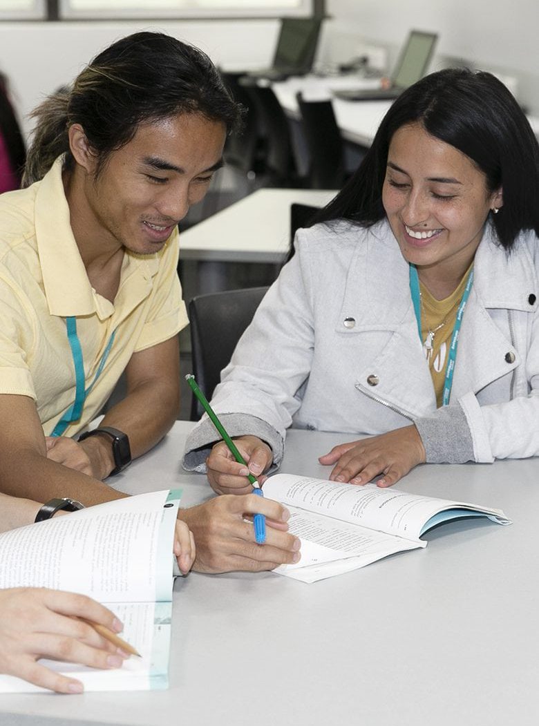 2 Sarina Russo Institute students study together in the Brisbane City, campus library