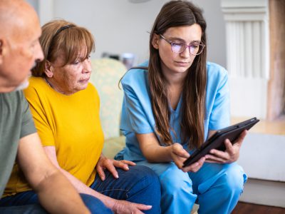 aged care worker talking to patient